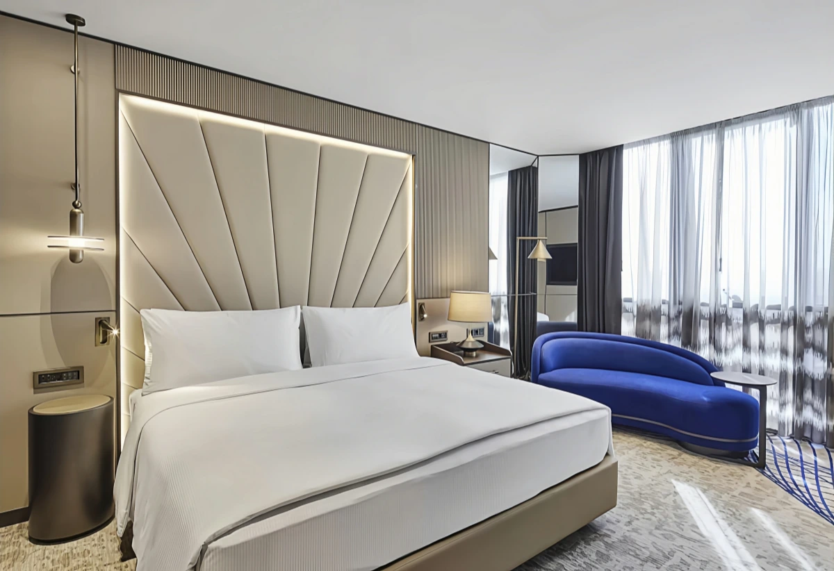 Sleek Luxury with Statement Seating Hotel Room Design